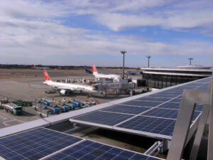 Eco-Friendly Aircraft Over Solar-Powered Airport