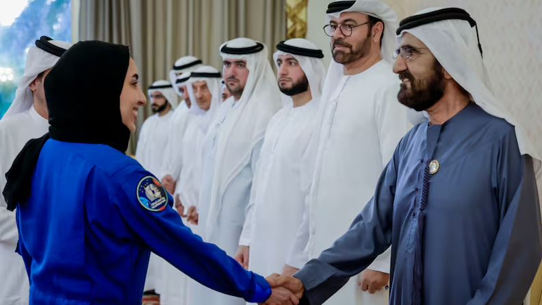 Sheikh Mohammed bin Rashid, Vice President and Ruler of Dubai, greets Emirati astronaut Nora Al Matrooshi