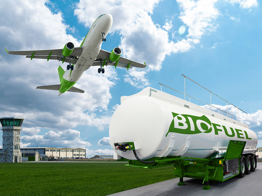 airplane taking off with a background of green fields, symbolizing the use of biofuels