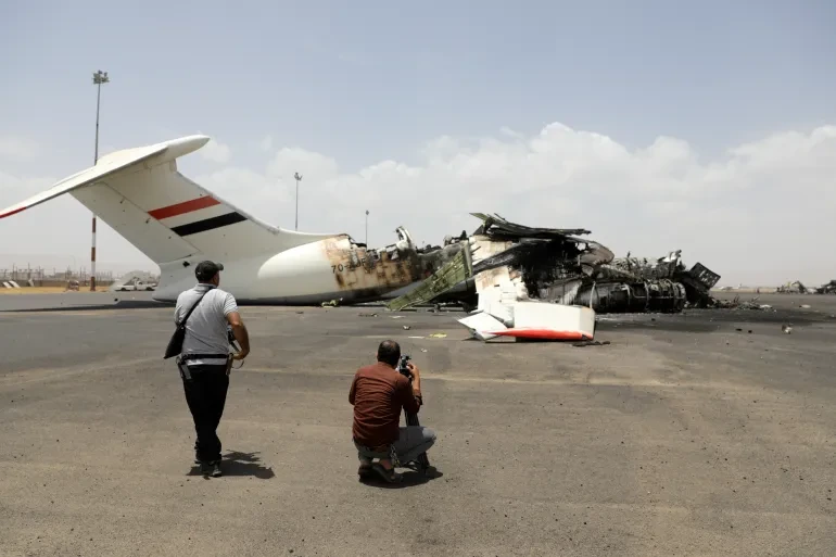 A dramatic image of an airport runway in flames or an aerial view of a damaged airport.